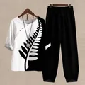 Detailed view of women's two-piece set with fern print top and black trousers - S / Top And Bottom / White