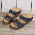 Vintage navy blue wedge sandals for women with lattice cutout on rustic wood floor - 36 / Dark Blue