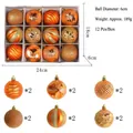 Set of 12 orange painted Christmas ornaments with diverse textures and patterns - 12 Pieces/Pack / Orange