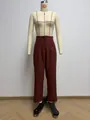 Detailed view of women's high-waisted reddish-brown straight leg trousers on mannequin - S / Bottoms / Burgundy