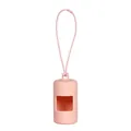 Macro view of a soft pink silicone dog poop bag dispenser with a portable strap - Pink