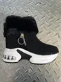 Side view showing the thick platform sole and faux fur trim of the black winter snow boot - 36 / Black