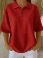 Detailed view of women's red waffle knit short sleeve polo shirt with button collar - Red