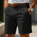 Detailed close-up of men's black business casual pleated shorts featuring a cuffed hem - S / Bottoms / Black