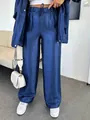 Detailed view of women's shiny blue wide-leg trousers with drawstring elastic waist. - S / Bottoms / Navy Blue