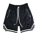 Men's breathable mesh basketball shorts with zipper pockets and white striped trim. - 3XL / Bottoms / Black