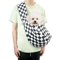 Portable black and white checkerboard pet carrier sling bag worn by a model for small dogs - Black and White Checkered (with Phone Pocket)