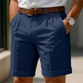 Detail view of navy blue pleated chino shorts with business casual styling - Dark Blue
