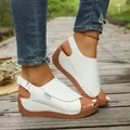 Close-up of stylish white wedge platform sandals for women on a wooden path - 36 / White