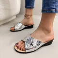 Close-up detail of silver metallic cross-strap wedge sandals with textured surface finish - 38 / Metallic Texture Snake Print Cross Strap Style / Silver