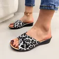 Close-up detail of leopard print wedge sandals showing the stylish animal pattern and texture. - 38 / Plush Leopard Peep Toe Style / Leopard Print