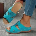 Detail view of blue wedge platform sandals with hollow-out design and striped pattern. - 38 / Light Blue