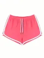 Vista dettagliata dei pantaloncini sportivi rosa da donna con profili bianchi e coulisse - Rosa