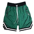 Detailed view of men's green mesh basketball shorts with zipper pockets and striped trim - M / Bottoms / Green