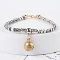 Adjustable ethnic style woven pet collar with a vintage brass bell for small dogs and cats - XS (Neck 15-20cm) / Black and White