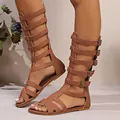 Stylish brown high-top gladiator sandals featuring a multi-strap buckle design on legs - 38 / Flat Gladiator Boots / Brown