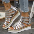 Close-up detailed view of silver metallic gladiator wedge sandals with back zipper. - Silver