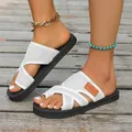 Close-up detail of white mesh criss-cross platform slides worn on model outdoors - 38 / White