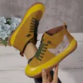 Close-up of yellow high-top women's shoes featuring a cute cat pattern and green laces. - 36 / Yellow