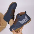 Close-up of blue high-top casual shoes featuring a cute cat graphic and brown laces - 36 / Blue