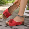 Elegant red wedge slippers for women with large flower decor and non-slip outdoor sole. - 38 / Red