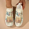 Vue détaillée de baskets à enfiler en maille avec un imprimé graphique « FAITH ». - 38 / Motif FAITH