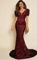 Detailed view of burgundy sequined texture and mermaid silhouette on a V-neck gown - S / Dresses / Burgundy