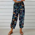 Detailed view of high-waist cotton linen pants with vintage floral print and drawstring - S / Orange Floral