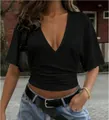 Detail of a women's slim-fit black V-neck t-shirt with waist ruching - XS / Tops / Black