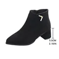 Detail of the 5.5cm block heel and suede texture of black pointed-toe ankle boots. - 38 / Black
