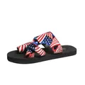 Detail view of a comfortable flat slide sandal with American flag patterned straps. - 44 / USA Flag Style