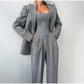 Elegante completo tre pezzi grigio spigato con top a corsetto e pantaloni larghi - Taglia S / Sopra e sotto / Grigio