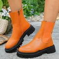 Bottines Martin orange vif à semelles épaisses avec fermeture éclair en plein air. - Orange