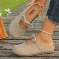 Elegant beige women's Birkenstock style mule sandals with a decorative bow accent - 36 / Khaki