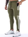 Detail view of men's olive green athletic joggers featuring side stripes and cargo pockets - S / Bottoms / Army Green