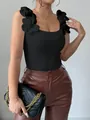 Dettaglio del top in maglia nera con eleganti fiori 3D sulle spalline sottili - Taglia S / Top / Nero