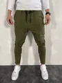 Detail view of men's olive green slim-fit joggers with zipper ankles and drawstring waist. - M / Bottoms / Green