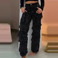 Close-up showing the intricate sparkling rhinestone details on black high-waisted cargo pants. - XS / Bottoms / Black