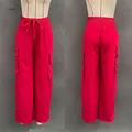 Vues détaillées avant et arrière d'un pantalon cargo rouge avec de grandes poches - S / Bas / Rouge