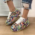 Detailed view of women's chunky platform sneakers featuring vibrant colorful graffiti art - 36 / Purple