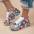 Detailed view of stylish graffiti print women's sneakers with chunky white soles. - 36 / Red