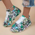 Detailed view of vibrant graffiti-style platform sneakers for women with white laces - 36 / Green