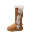 Side view of tall tan snow boot with fluffy faux fur trim and decorative silver buckles - 41 / Camel