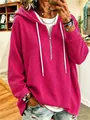 Close-up of women's magenta waffle knit hoodie featuring half-zip and drawstrings. - S / Tops / Rose Red