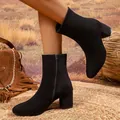 Close-up of elegant black suede ankle boots with side zipper and chunky block heel. - 38 / Black Faux Suede