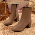 Brown suede block heel ankle boots with side zipper shown in a rustic outdoor setting - 38 / Light Brown Faux Suede