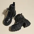 Detailed macro shot of black platform combat boots featuring rivets and silver buckle straps - 35 / Black