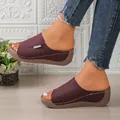 Detailed view of burgundy peep toe wedge platform sandals with white stitching detail - Burgundy
