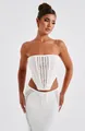 Detailed view of a white crochet knit two-piece set featuring a tube top and maxi skirt - S / Top And Bottom / White