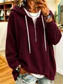 Detailed view of women's burgundy waffle knit drawstring hoodie with a half-zip closure - Burgundy